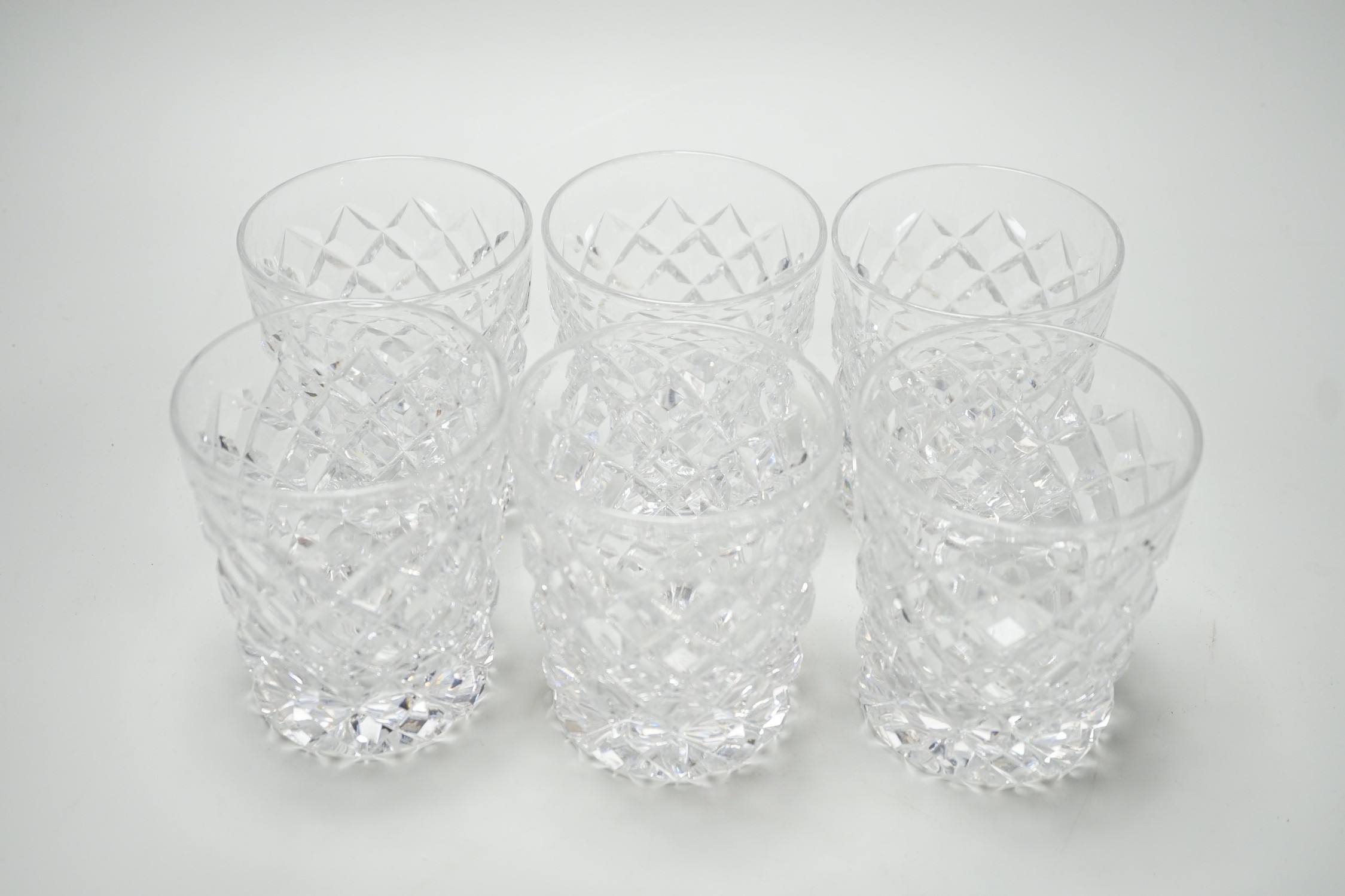 A set of six heavy hobnail cut glass whisky tumblers. 10cm high